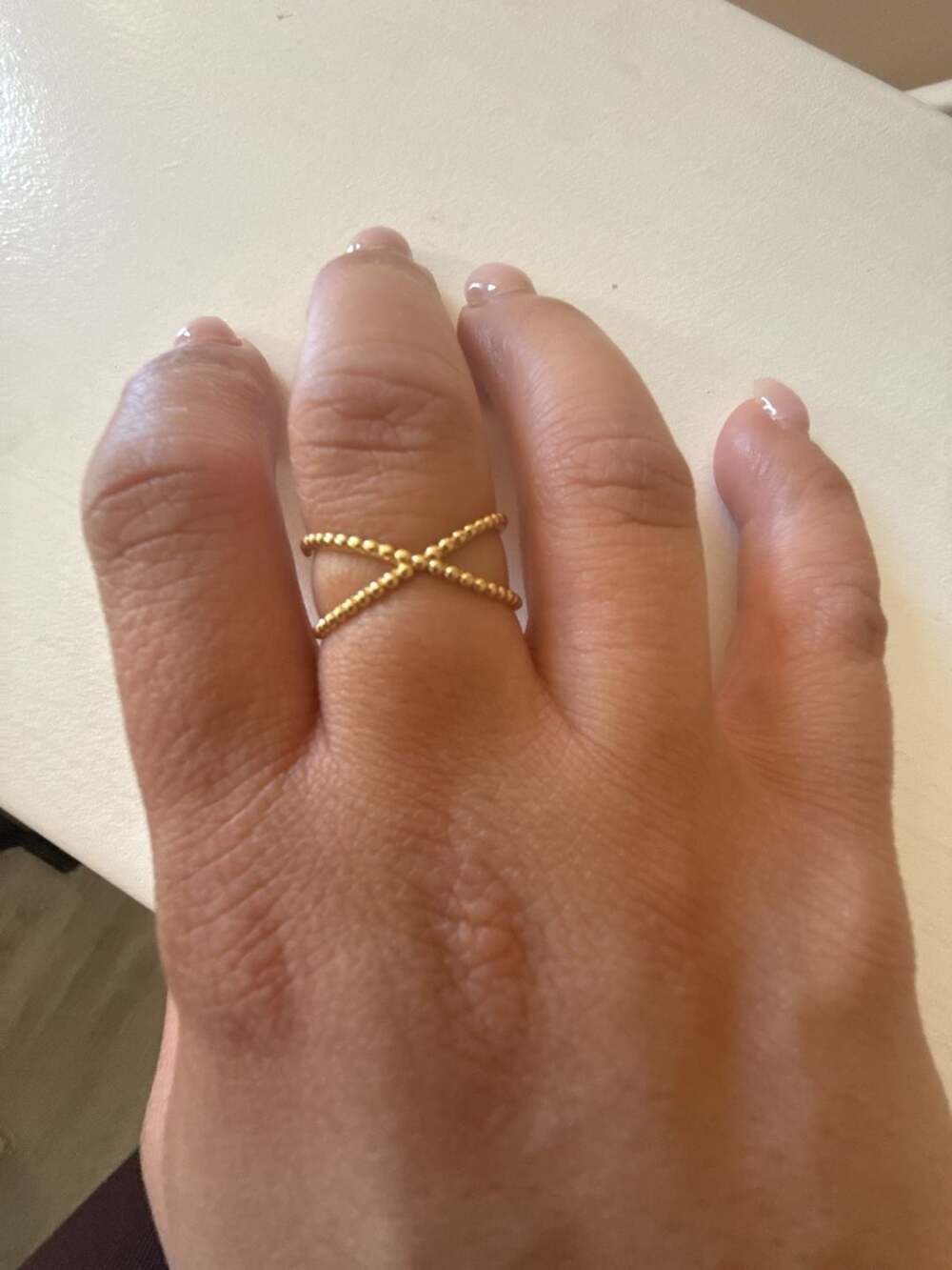 Unbranded Criss Cross Ring Size 9 Yellow Gold slid 18 K . Weight is 2.15 gramBea